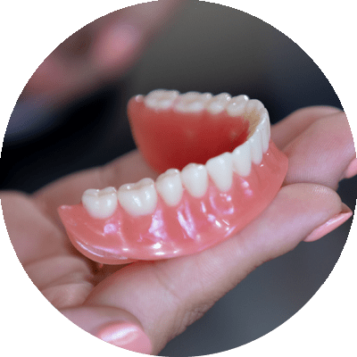 denture in hand
